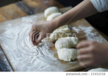 Hand making bread 21452516