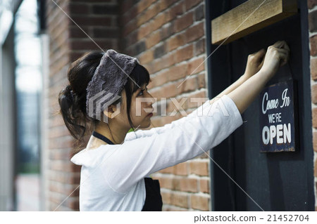 A woman preparing for opening A woman preparing for opening 21452704