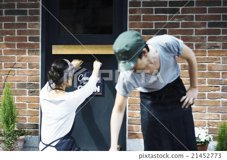 A woman preparing for opening A woman preparing for opening 21452773