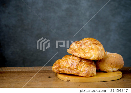 croissant bakery on teak wood table 21454847
