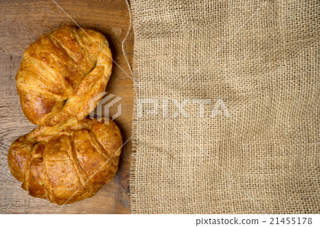 croissant bakery on burlap teak wood table 21455178