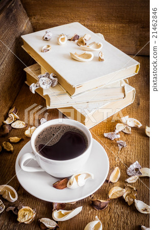 Cup of coffee and stack of old books 21462846