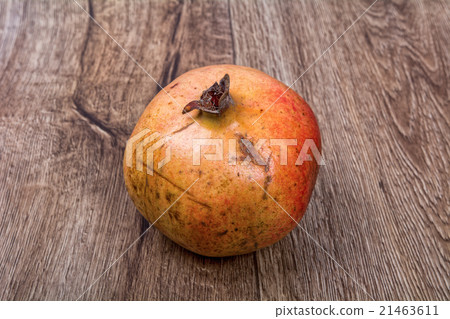 Pomegranate on a wooden background Pomegranate on a wooden background 21463611