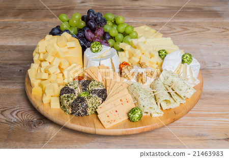 Cheese plate variation on a wooden table Cheese plate variation on a wooden table 21463983