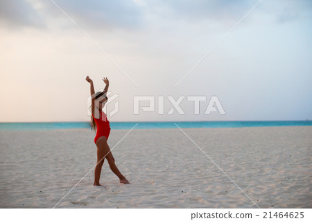 Adorable little girl during beach vacation having Adorable little girl during beach vacation having 21464625