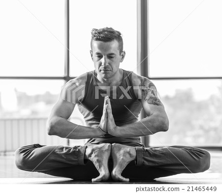 Athletic muscular young man working out, yoga 21465449