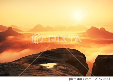 Warm misty autumn land in red colorful vapor. Rock Warm misty autumn land in red colorful vapor. Rock 21470841