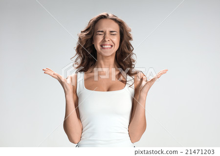 The young woman's portrait with happy emotions The young woman's portrait with happy emotions 21471203