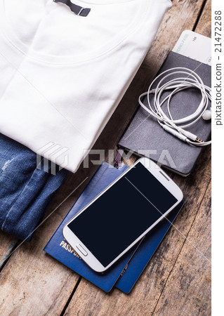 Woman travelling stuff on wooden background. 21472288