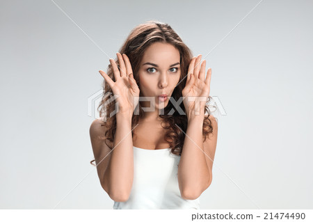 The young woman's portrait with funny emotions The young woman's portrait with funny emotions 21474490