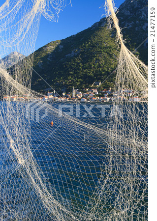 view of the Bay of Kotor through the fishing net 21477159
