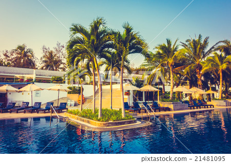 Beautiful Silhouette palm tree with umbrella and chair 21481095