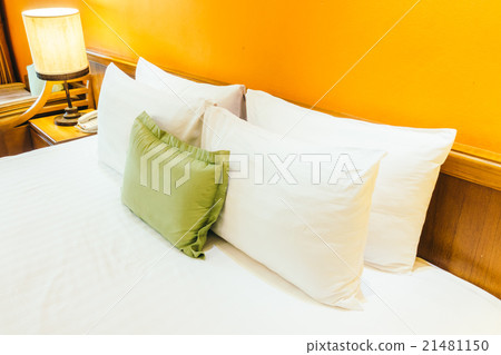 Pillow on bed with light lamp Pillow on bed with light lamp 21481150