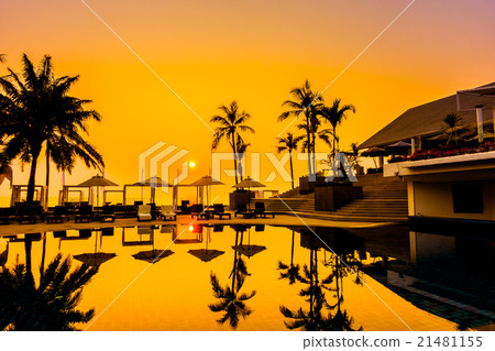 Beautiful Silhouette palm tree with umbrella and chair Beautiful Silhouette palm tree with umbrella and chair 21481155