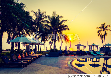 Beautiful Silhouette palm tree with umbrella and chair Beautiful Silhouette palm tree with umbrella and chair 21481254