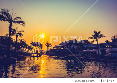 Beautiful Silhouette palm tree with umbrella and chair Beautiful Silhouette palm tree with umbrella and chair 21481257