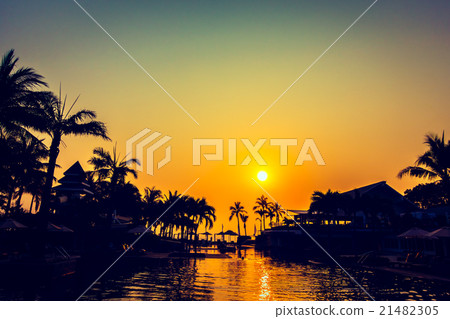 Beautiful Silhouette palm tree with umbrella and chair 21482305
