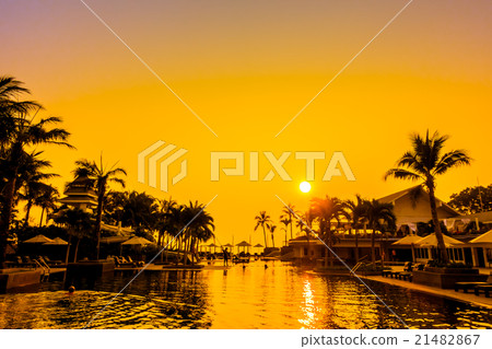 Beautiful Silhouette palm tree with umbrella and chair Beautiful Silhouette palm tree with umbrella and chair 21482867