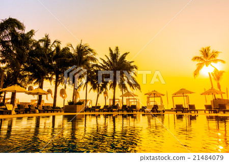 Beautiful Silhouette palm tree with umbrella and chair Beautiful Silhouette palm tree with umbrella and chair 21484079
