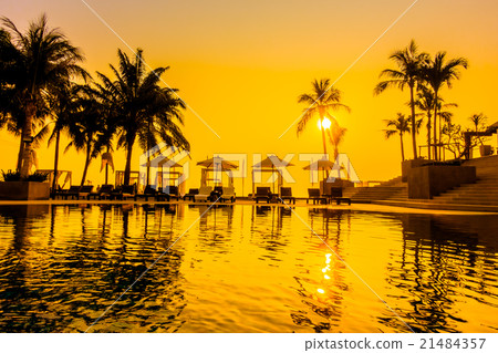 Beautiful Silhouette palm tree with umbrella and chair 21484357