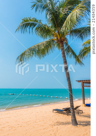 Beautiful beach and sea with palm tree Beautiful beach and sea with palm tree 21484359