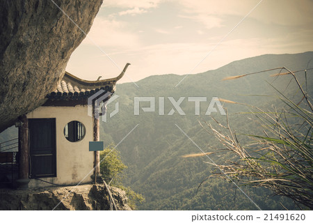 Chinese temple in the cliff and mountain scenery (Wenzhou yandang mountain in China.) Chinese temple in the cliff and mountain scenery (Wenzhou yandang mountain in China.) 21491620