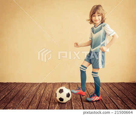Child is pretending to be a soccer player Child is pretending to be a soccer player 21500664