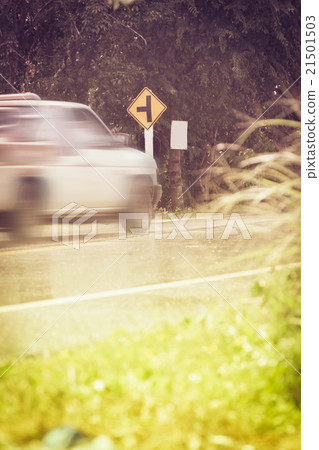 Traffic sign, motion blurred pick-up truck. 21501503