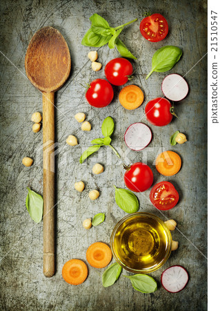 Wooden spoon and fresh ingredients Wooden spoon and fresh ingredients 21510547