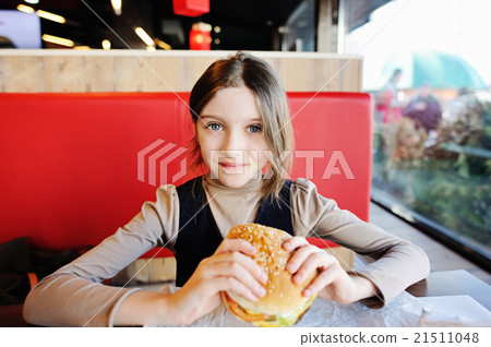 Cute school girl with hamburger Cute school girl with hamburger 21511048