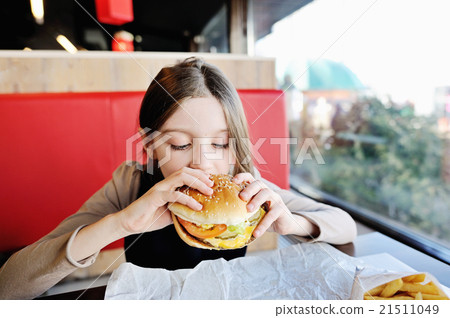 Cute school girl with hamburger Cute school girl with hamburger 21511049