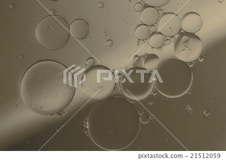 Oil drops on a water surface Oil drops on a water surface 21512059