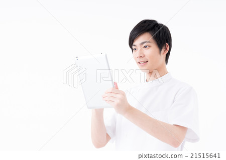 A young man in a white coat A young man in a white coat 21515641
