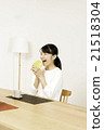 A young woman eating melon bread A young woman eating melon bread 21518304