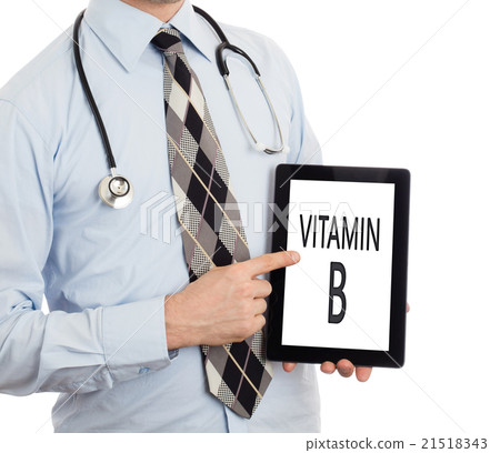 Doctor holding tablet - Vitamin B Doctor holding tablet - Vitamin B 21518343