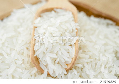 Jasmine rice with wooden spoon. Jasmine rice with wooden spoon. 21519829
