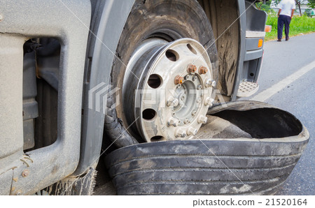 Damaged 18 wheeler semi truck burst tires  21520164
