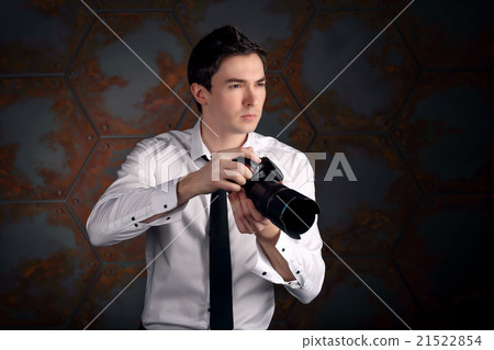 Photographer with camera in studio Photographer with camera in studio 21522854