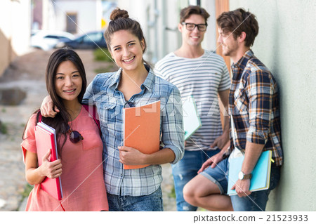 Hip friends holding notebooks Hip friends holding notebooks 21523933