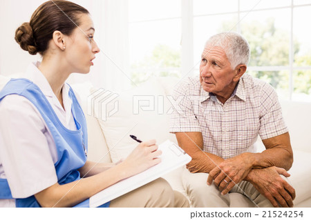 Nurse taking care of sick elderly patient 21524254