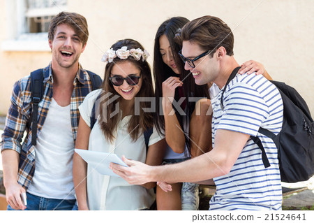 Hip friends looking at tablet 21524641
