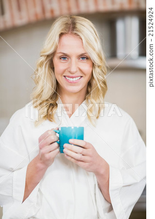 Pretty woman having a cup of coffee Pretty woman having a cup of coffee 21524924