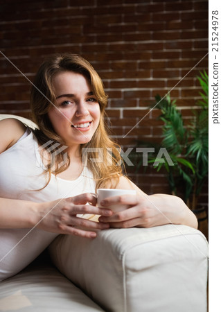 Pretty woman drinking coffee Pretty woman drinking coffee 21524978