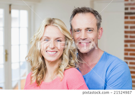 Cute couple smiling at camera Cute couple smiling at camera 21524987