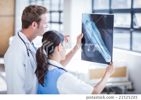Medical team looking at x-ray together Medical team looking at x-ray together 21525285
