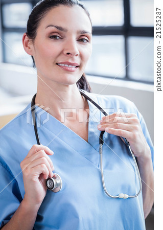 Nurse smiling at the camera Nurse smiling at the camera 21525287