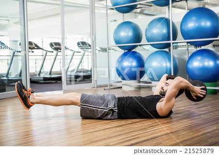 Man doing exercise with medicine ball Man doing exercise with medicine ball 21525879