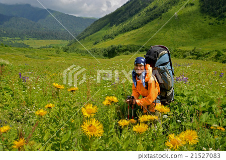 tourist surrounded with flowers 21527083
