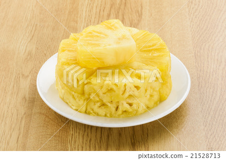 Sliced pineapple on white plate Sliced pineapple on white plate 21528713