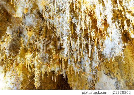 Many white stalactites inside of cave Many white stalactites inside of cave 21528863